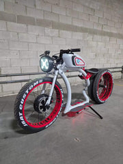 Custom retro electric cruiser in silver and red, front three-quarter view