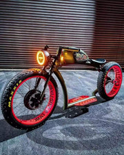 Custom retro electric cruiser in olive and red, illuminated front view