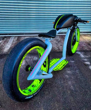 Custom retro electric cruiser in grey and neon green, rear three-quarter view