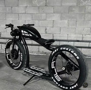 Custom retro electric cruiser in black and white, rear three-quarter view